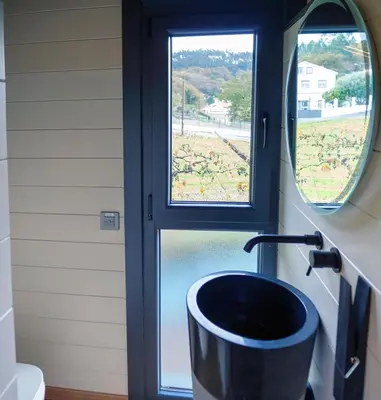 a bathroom with a sink and a window at Vencello Estelar Compostela in Santiago de Compostela