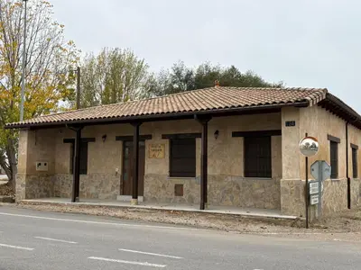 a building on the side of the road at La Venta del Clavo in Astorga