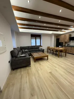 a living room with a couch and a table at La Venta del Clavo in Astorga