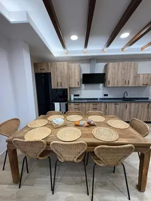 a large wooden table with chairs in a kitchen at La Venta del Clavo in Astorga