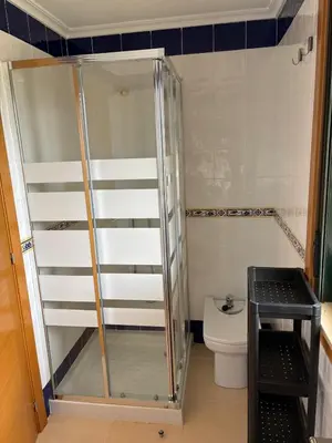 a shower in a bathroom with a toilet at El rincón de la Mariña in San Cosme de Barreiros