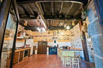 a hotel room with two beds and a mirror at Casa Dulcinea - casa rural en Ribeira Sacra in Serode