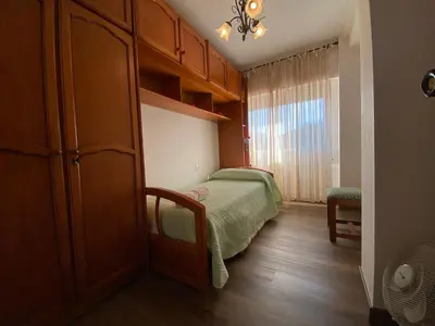 a living room with a table and chairs and a couch at Apartamento Cascallar in Caldas de Reis
