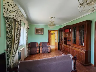 a living room with two chairs and a couch at Charming house & natural setting in Palas de Rei in Palas de Rei