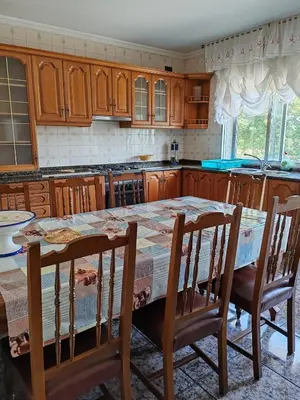 a small bedroom with a bed and a window at Charming house & natural setting in Palas de Rei in Palas de Rei