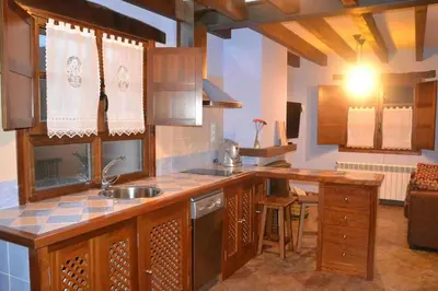 a kitchen with a sink and a counter top at Apartamento La Casa del Abuelo Justo in Miñagón