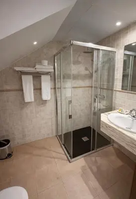 a bathroom with a shower and a sink at hostal Saint James Way in Cacabelos