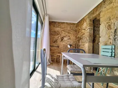 a dining room with a table and chairs at Alojamientos as moras arans in La Cañiza