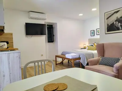 a living room with a couch and a table at Alojamiento cruceiro Arans in La Cañiza