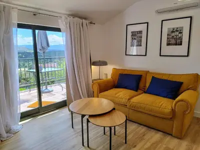 a living room with a couch and a table at Alojamientos arans in La Cañiza