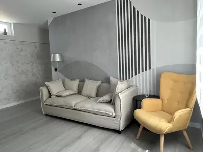 a living room with a couch and a chair at VUT La CEPEDA in Astorga