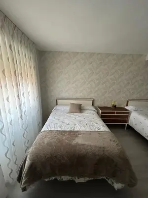 a bedroom with a bed and a wall at VUT La CEPEDA in Astorga