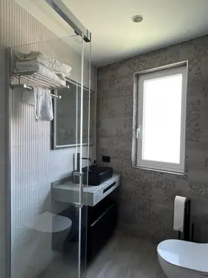 a bathroom with a sink and a glass shower at VUT La CEPEDA in Astorga