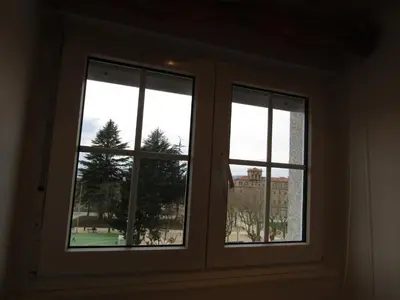 three windows in a room with a view at Atico centrico Lela Lemos-3 habitaciones y 3 baños in Monforte de Lemos