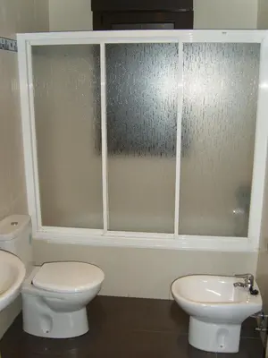 a bathroom with a toilet and a sink at Hostal Las Eras in Cubillos del Sil