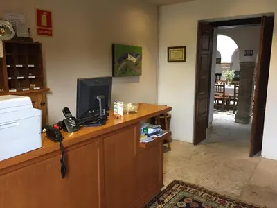 an office with a desk with a phone on it at Pazo Torre Do Barrio in Loseiro