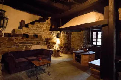 a living room with a couch and a fireplace at La Casa Grande Del Valle in El Valle