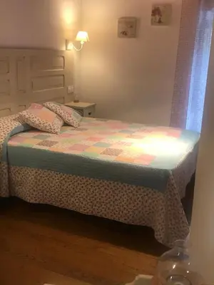 a bed with two pillows on it in a room at La Casa Grande Del Valle in El Valle