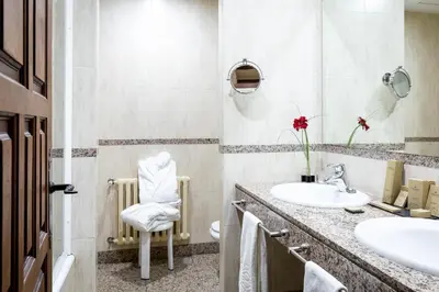 a bathroom with a sink and a mirror at Parador de Monforte de Lemos in Monforte de Lemos