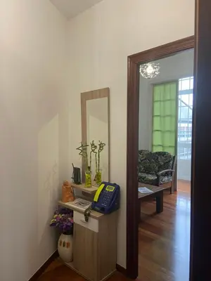 a room with a mirror and a phone on a table at Pensión Hedrass in Santiago de Compostela
