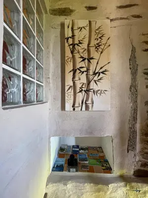 a room with a wall with paintings on the wall at Galicia Retreat in Santa Marta de Ortigueira