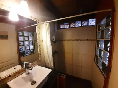 a bathroom with a sink and a mirror at Galicia Retreat in Santa Marta de Ortigueira