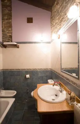 a bathroom with a sink and a mirror at Balcón de Oscos in Santa Eulalia de Oscos