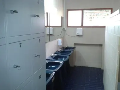 a row of sinks in a public bathroom at Apartamento Viveiro, Terraza Grande, 2 dormitorios 2 baños, piscinas, parking, tenis, club social in Jove