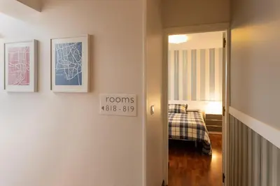 a hallway with a room with a bed at Pension Residencia F&F in Santiago de Compostela
