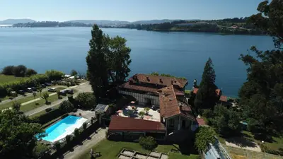 an aerial view of a house with a swimming pool at Pazo da Merced in Neda