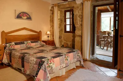 a bedroom with a bed in a room at Lugar dos Devas in Covelo
