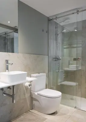 a bathroom with a toilet and a sink and a shower at Hotel Atalaia in Santiago de Compostela