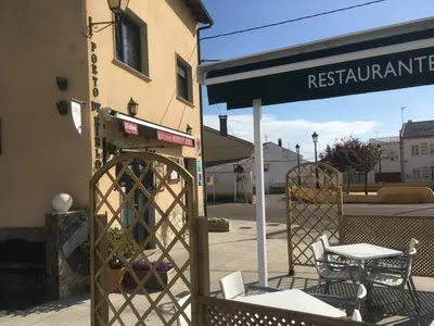 a table and chairs sitting outside of a restaurant at Porto de Rinlo in Rinlo