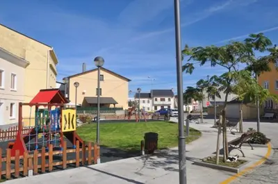 a playground with a slide in a park at Porto de Rinlo in Rinlo