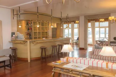 a living room with a bar and a couch at Parador de Ribadeo in Ribadeo