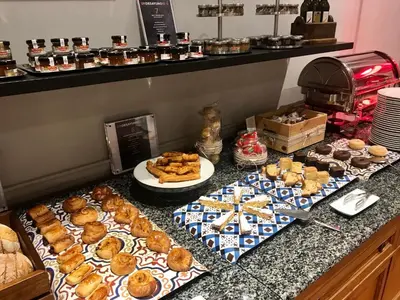 a buffet of pastries and other pastries on a counter at Parador de Ribadeo in Ribadeo