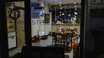 a dining room with a table and chairs in a restaurant at Via Stellae in Tamallancos