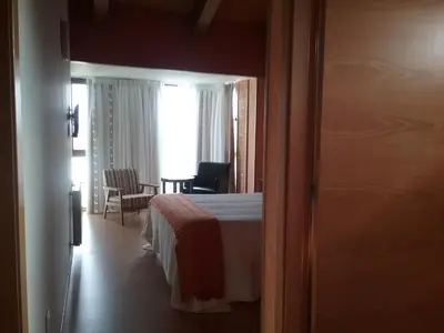 a hotel room with a bed and a table at Via Stellae in Tamallancos