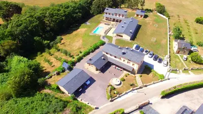 an aerial view of a large house with a pool at Apartamentos Navalin in Tapia de Casariego