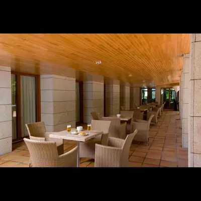 a restaurant with tables and chairs in a building at Parador de Puebla de Sanabria in Puebla de Sanabria