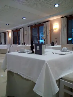 a table with a white table cloth on it at Parador de Puebla de Sanabria in Puebla de Sanabria