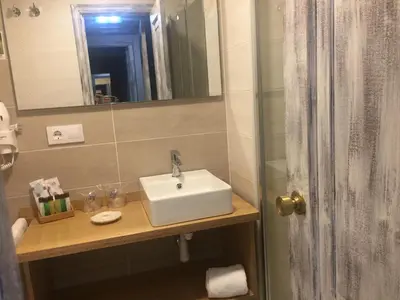a bathroom with a sink and a mirror at Hotel Celanova in Celanova