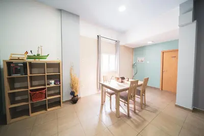 a dining room with a table and chairs at Albergue Barullo - Cubículos - Literas - Habitaciones in Sarria
