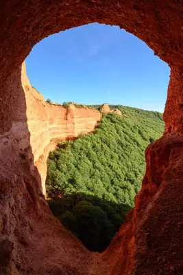 a view from a hole in a rock formation at Casa do Eiró in Lago de Carucedo