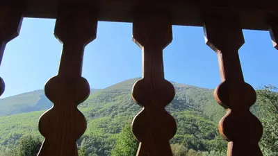a window with a view of a mountain at Apartamentos Turísticos Cabrera in Tejedo de Ancares