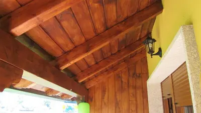 a wooden ceiling over a door in a house at Apartamentos Turísticos Cabrera in Tejedo de Ancares