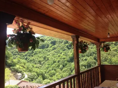 a view from a porch with a view of a forest at Casa Rural La Corrada in Llamoso