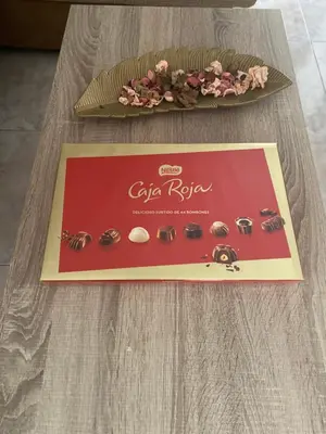 a box of coffee riser earrings on a table at Casa Rural La Corrada in Llamoso
