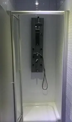 a shower in a bathroom with a glass shower stall at Albergue O Trisquel in O Pedrouzo