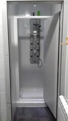 a white shower with a glass door in a bathroom at Albergue O Trisquel in O Pedrouzo